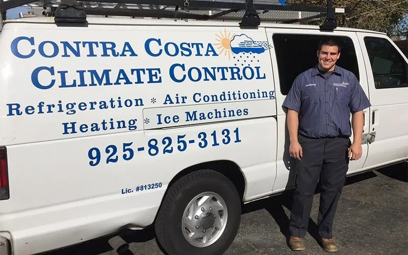 Hvac Tech In Front Of Van